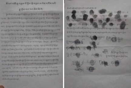 Kopie der mit Fingerabrücken unterzeichneten Petition (Foto: Radio Free Asia)